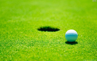 Golf ball hole grass background - a hole free wallpaper