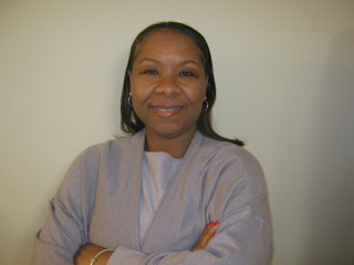 Woman crossed arms smiling white - head and shoulders portrait free wallpaper for desktop