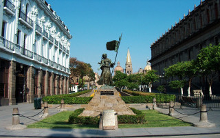 Statue man flag courtyard fountain - a statue of a man holding free wallpaper