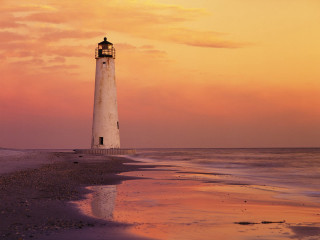 Lighthouse beach sunset pink sky - a pink sky in the background free wallpaper