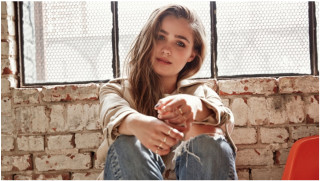 Woman sitting brick wall window - a brick wall free wallpaper