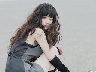 Woman sitting ground legs crossed 6 - a black dress free wallpaper