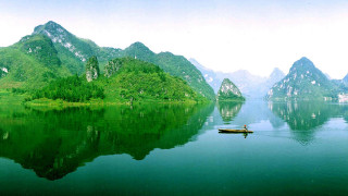 Person boat lake mountains trees - cao buxing free wallpaper