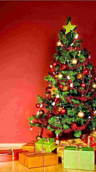 Christmas tree presents under star - free christmas wallpaper for mobile