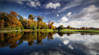 Lake trees clouds golf course 3 - a green field and trees free wallpaper for desktop
