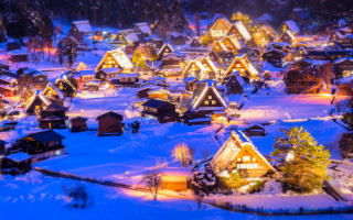 Village lit night snow houses - a village free wallpaper