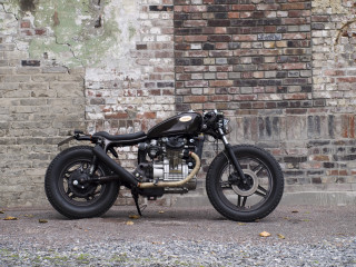 Motorcycle parked brick wall black - artgem free wallpaper