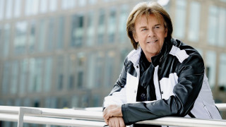 Man leaning rail building background - cliff childs free wallpaper