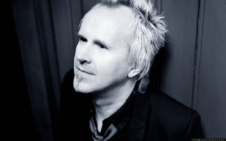 Man messy bun serious look - his hair free wallpaper