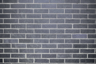 Man suit tie brick wall 2 - david chipperfield free wallpaper