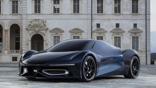 Futuristic car parked large building - a futuristic car free wallpaper