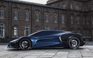 Futuristic car parked large building 2 - a futuristic car free wallpaper