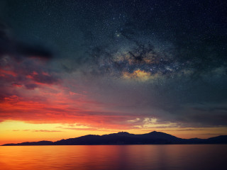 Sunset starry sky mountain night - orange glow free wallpaper