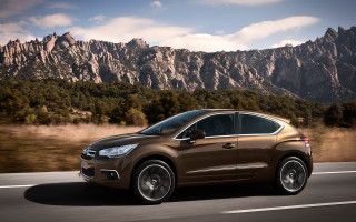 Brown car driving road mountains - a brown car free wallpaper for desktop