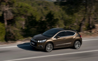 Brown car driving forest road - a brown car free wallpaper for desktop