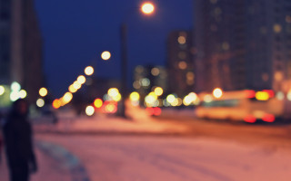 Person walking snowy street night - a snowy street free wallpaper