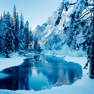 Snowy landscape river trees mountain - free winter wallpaper for tablet