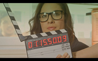 Woman holding clapper movie face - a woman holding free wallpaper