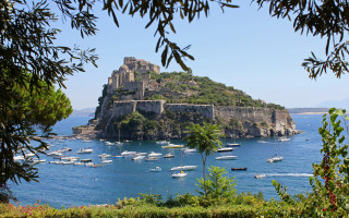 Small island castle boats trees - panoramic view free wallpaper for desktop