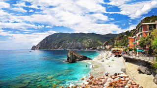 Beach cliff water people mountain - a cliff and a body of water free wallpaper