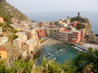 Small village water boats hill - a hill in the background free wallpaper