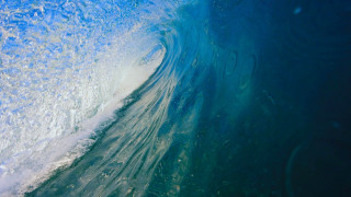 Wave breaking blue white bubbles - a wave free wallpaper