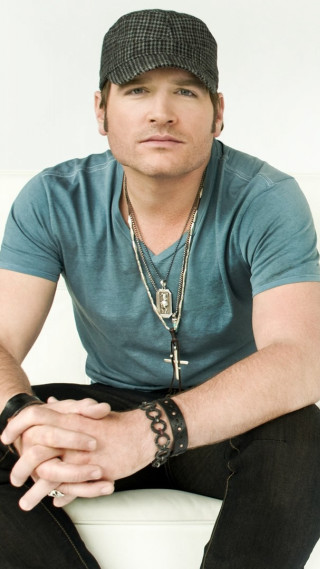 Man sitting white couch hat 2 - christopher rush free wallpaper