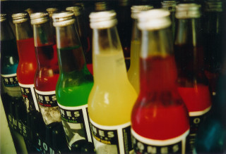Soda bottles colored drinks row - fluxus free wallpaper