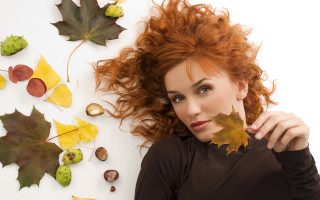 Woman red hair leaf face - red hair holding free wallpaper