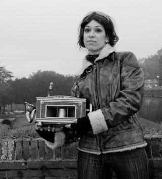 Woman holding small box clock - new free wallpaper for tablet