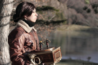 Woman holding wooden box figurines - dieselpunk free wallpaper