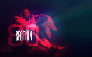 Man sitting microphone section8 red - constant free wallpaper