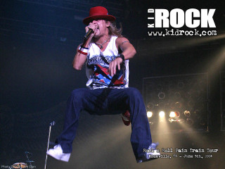 Man red hat stage microphone - his hand and a microphone free wallpaper