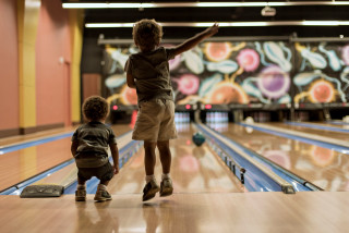 Boy bowling alley shallow depth - a young boy free wallpaper