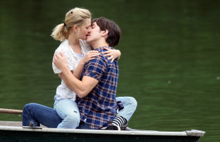 Man woman kissing boat lake 2 - the water of a lake free wallpaper