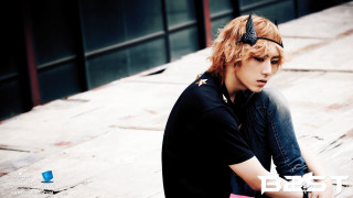 Young man skateboard wooden floor - a black bow free wallpaper