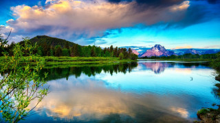 Lake mountains trees cloudy sky 29 - mountain and trees under a cloudy sky free wallpaper
