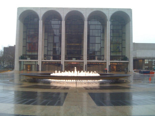Fountain building arches windows clock - a fountain in front free wallpaper