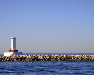 Lighthouse rock wall ocean boat - the water below free wallpaper