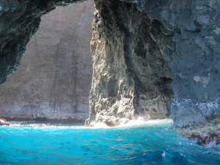 Cave blue pool rock formation - a blue pool in the middle of it free wallpaper