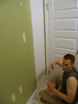 Man sitting door hammer painting - temporary free wallpaper