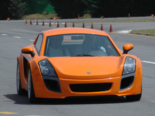 Orange sports car race track - a orange sports car free wallpaper