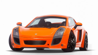 Bright orange sports car front 2 - vorticism free wallpaper