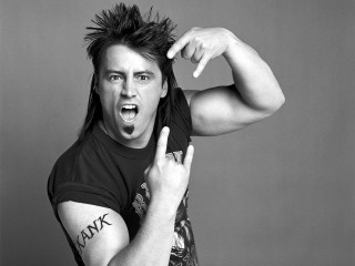 Mohawk man making face pointing - a face free wallpaper