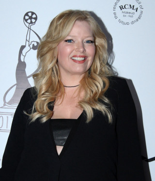 Blonde woman black dress smiling 2 - free dark wallpaper for tablet