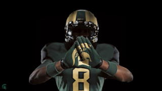 Football player green gold uniform - his hand together free wallpaper