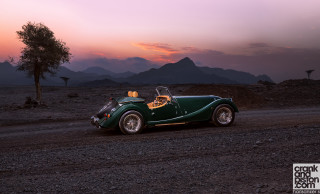 Green car desert sunset tree - a green car free wallpaper