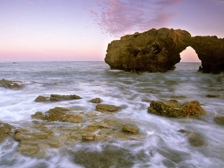Rocky beach rock formation pink - a pink sky in the background free wallpaper for desktop