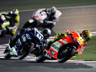 Motorcycle racers night race track - leaning free wallpaper