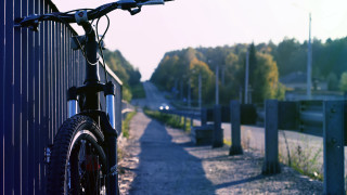 Bike parked fence roadside trees - a bike free wallpaper for desktop